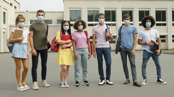 Students in Masks Against College Building
