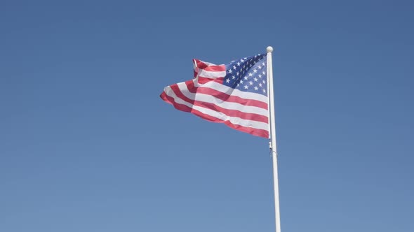 Slow motion United States of America flag fabric against blue sky 1920X1080 HD footage - Silk materi
