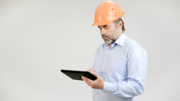 Engineer Typing Email on Tablet
