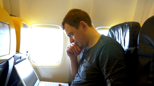 Busy Man On The Plane