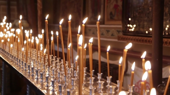 The Church Is Lit Many Candles Around The Icons