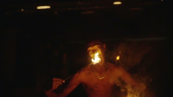 Fire Eater Performing At Night