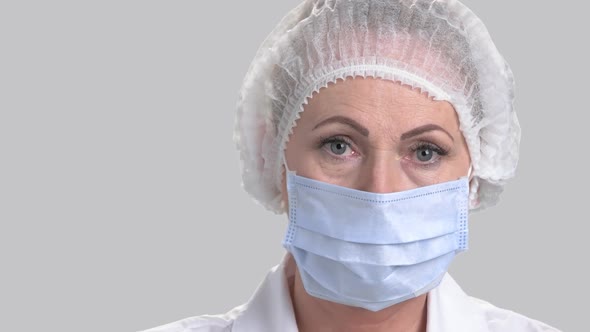 Female Doctor in Cap and Face Mask.