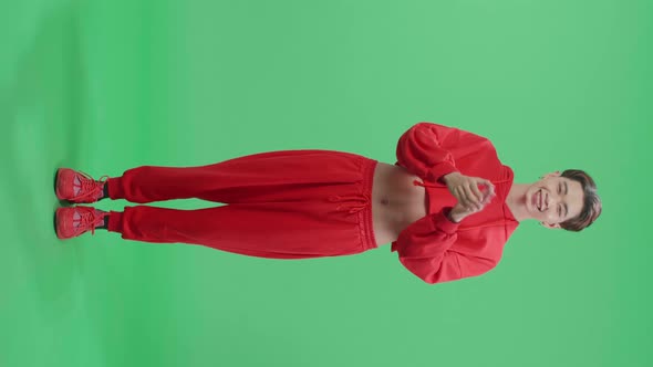 Full Body Of Young Asian Transgender Male Clapping Her Hands In The Green Screen Studio