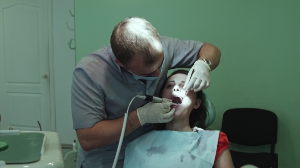 The Dentist Treats Tooth alt