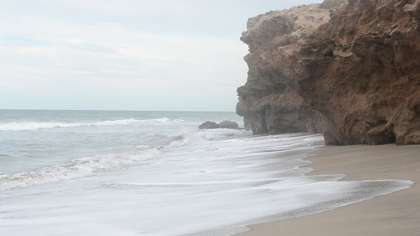 Cliffs, The Beach And The Sea Waves