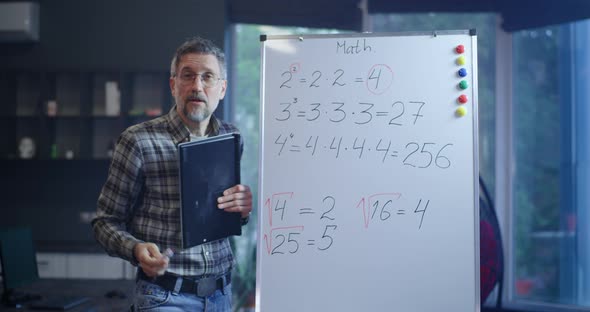 Teacher Explaining Math To Camera