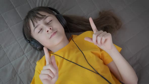 Teen with relax music in headphones.