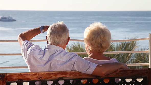 Senior Couple Relaxing On The Bench