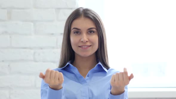 Hispanic Young Woman Inviting Customers with Both Hands