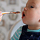 Mum Feeds the Child with a Spoon - VideoHive Item for Sale