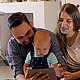 Young Parents with a Baby Watching in the Tablet - VideoHive Item for Sale
