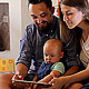 Young Parents with a Baby Watching in the Tablet - VideoHive Item for Sale