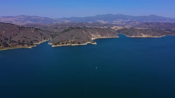 Flying over Lake Cachuma near Santa Barbara Ca. Beautiful shot of the water and California mountains