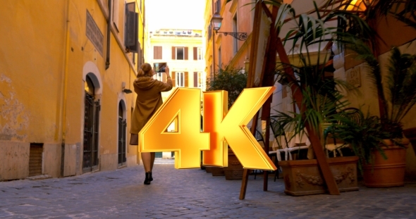 Woman In The Street Using Pad To Make Photo Or alt