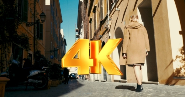 Woman Walking Along Old Narrow Street alt