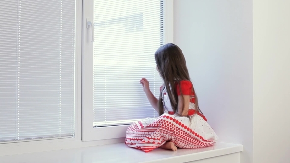 The Girl Is Sad At The Window In The Room.