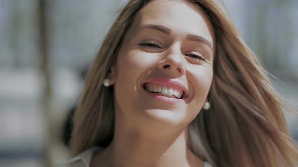 Attractive Young Woman Smiling at Camera