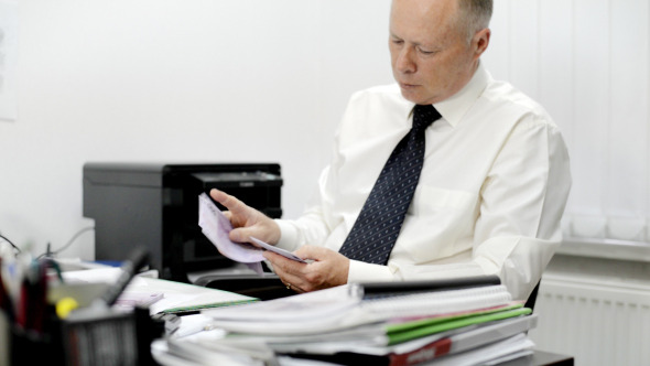 Businessman Counting Money