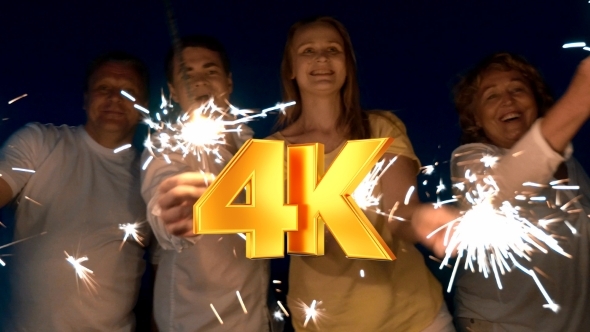 People Waving Lighting Sparklers