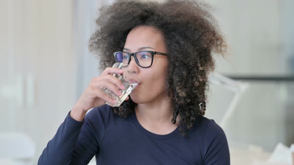 Thirsty African Woman Drinking Water
