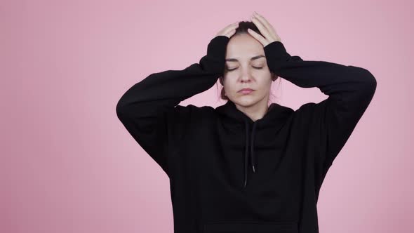 Young Caucasian Brunette Woman in Sweater Suffering From Headache or Migraines