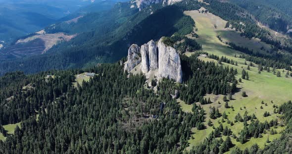 Bird's Eye View Of Unique Rock Formation Of The Loney Rock With Evergreen Forest At Daytime In Roman