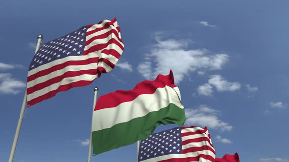 Row of Waving Flags of Hungary and the USA alt