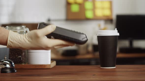 Paying with Smartphone Closeup Using NFC Technology in a Restaurant