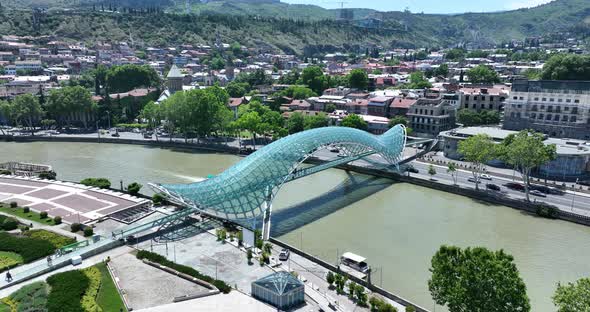 Aerial view of Tbilisi city central park and Bridge of Peace. Beautiful cityscape of old Tbilisi at