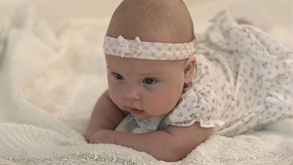 Baby Lying and Smiling alt