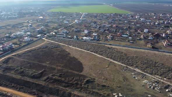 Aerial drone flying over houses.