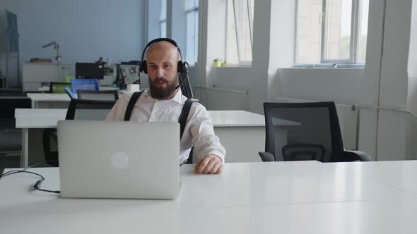 Businessman Making Conference Video Call on Laptop
