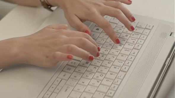 Woman Hands On The Keyboard