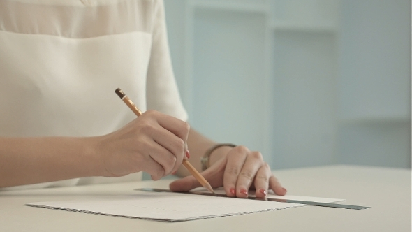 Woman Architect Drawing Line On a Ruler