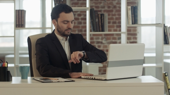 Businessman With Notebook In Office Finished Work