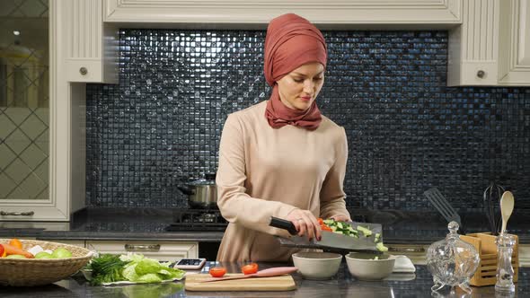 Attractive Housewife in Hijab Put Cut Fresh Vegetables in Deep Plates Preparing Halal Food