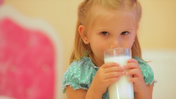 Adorable Little Girl Drinking Milk alt