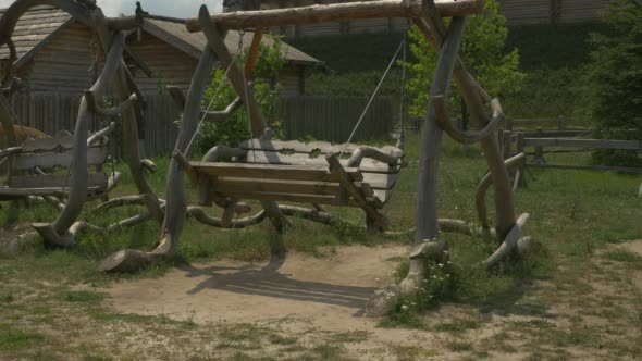 Two Wooden Swings, Swinging, Green Meadow, Hill,