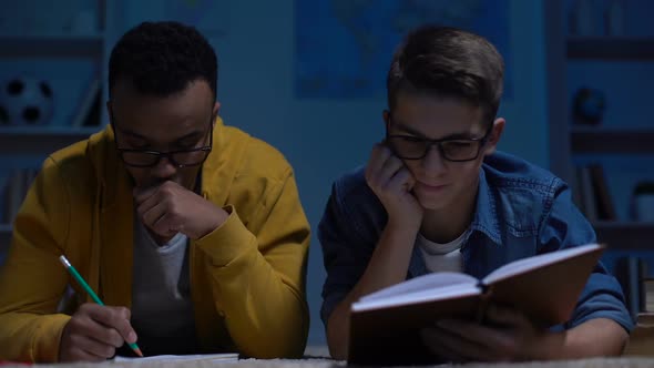 Afro-American and Caucasian Students Trying to Solve Difficult Assignment, Test