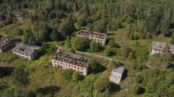 Aerial View of Abandoned and Destroyed Buildings From the Times of the USSR in a Green Picturesque