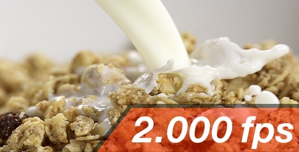 Pouring Milk Into A White Bowl With Cereals 3
