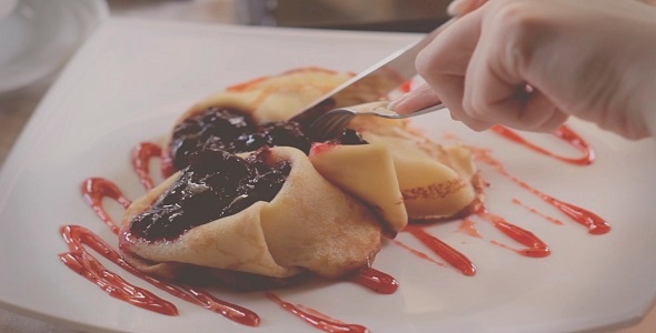 Woman Eating Dessert At A Restaurant