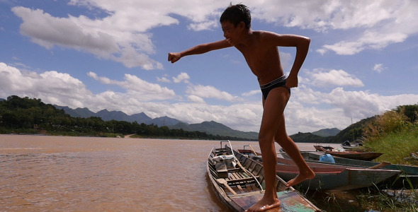 Young Boy Training Boxing On A Boat