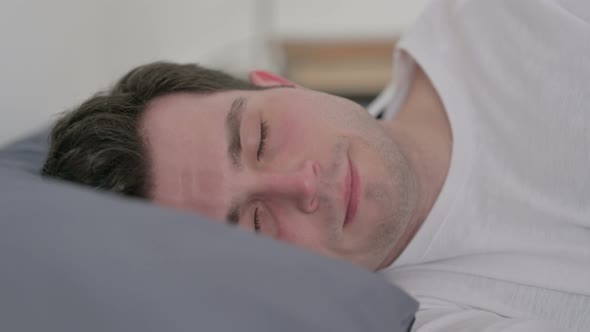 Man Sleeping in Bed Peacefully Close Up