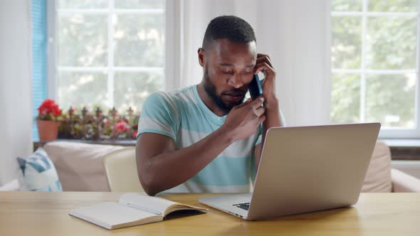 Attractive Young African Businessman Working From Home Online