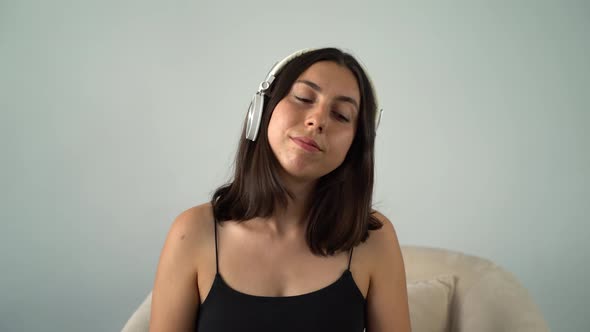 Young Woman Listening to Music and Dancing with Headphones 4K