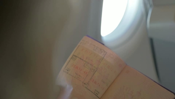 Turning Pages Of a Travel Passport