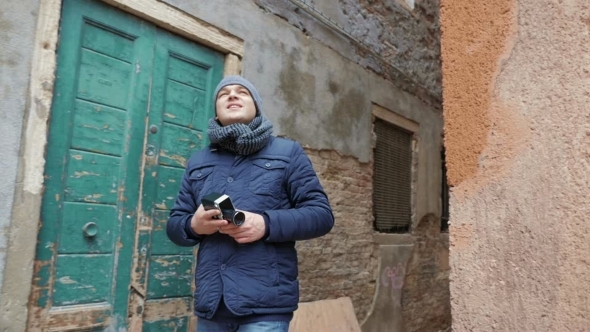 Male Tourist Walking In Old Town alt