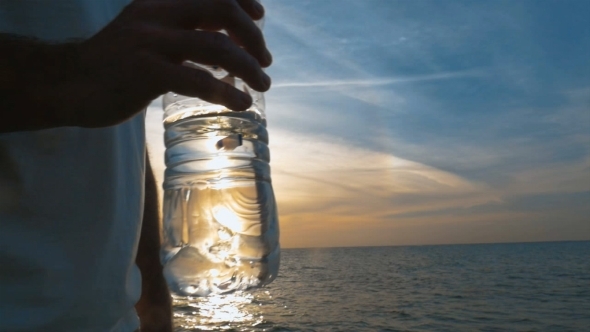 Water Bottle In Male Hand